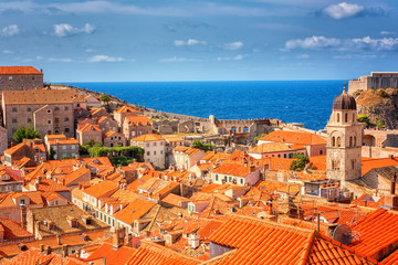 Fototapeta na wymiar Dubrovnik Old City red tiled roofs, panoramic view from the ancient city wall, scenic cityscape. World famous and most visited historic city of Croatia, UNESCO World Heritage site, travel background
