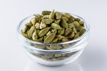 fragrant green cardamom on a white acrylic background