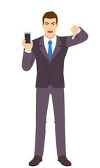 Angry Businessman holding a mobile phone and showing thumb down gesture as rejection symbol. Full length portrait of Businessman in a flat style.