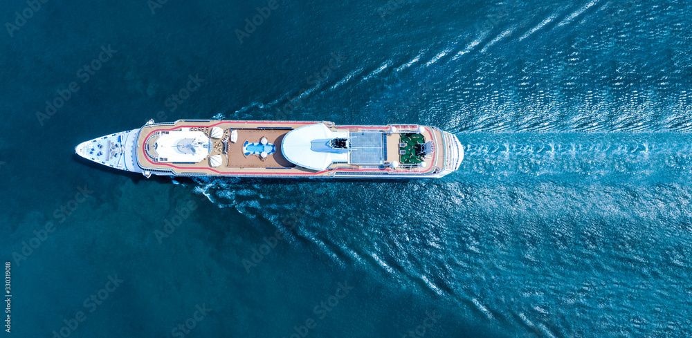 Wall mural aerial top view of beautiful white cruise ship luxury cruise at the sea beach concept tourism travel