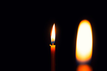 Two yellow candles, burns, illuminates, for celebrations, and for romance, of love