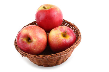 Apples on wicker plate