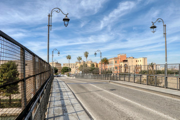 Fototapeta na wymiar The Bridge of San Francesco di Paola, commonly called Ponte Girevole (Swing Bridge) without cars and people in Taranto, Puglia, Italy