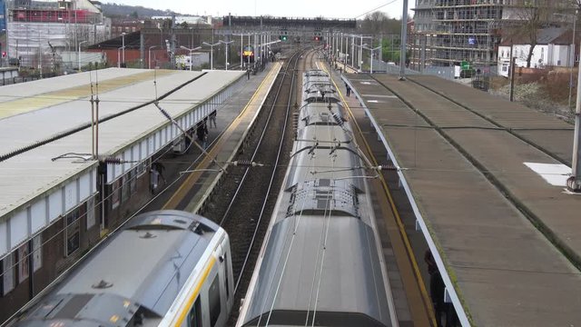 4K. Elevated view of Trains at Luton Station in exterior and cloudy day. Railway station in the Luton of London. Transport concept. Without pandemic.
