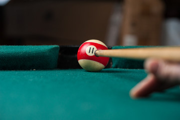 Billiards balls and cue on billiards table. Billiard sport concept