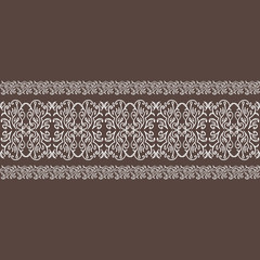 Beautiful elegant white seamless lace on dark brown background