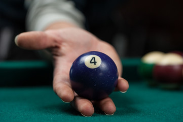 Billiards balls and cue on billiards table. Billiard sport concept