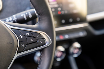 Buttons on steering wheel in a car