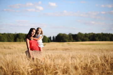 Summer landscape and a girl on nature walk in the countryside.