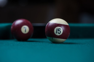 Billiards balls and cue on billiards table. Billiard sport concept