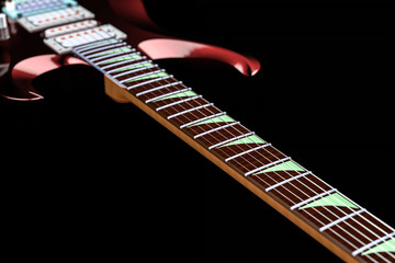 3D illustration. Red electric guitar isolated on black background. Metal, art, reflection.