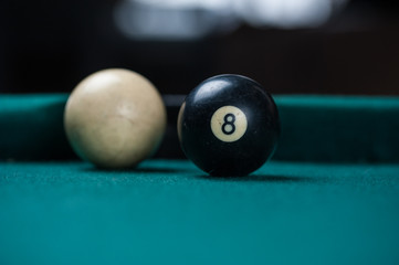 Billiards balls and cue on billiards table. Billiard sport concept