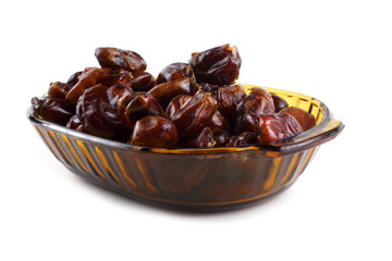 Date fruits on plate isolated on white