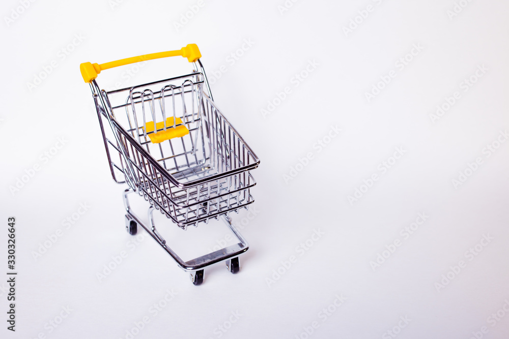 Wall mural Shopping cart concept of shopping and sales, retail and shops.