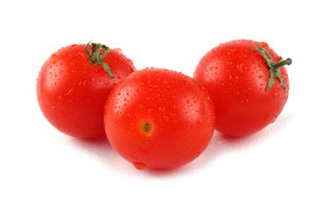 Three cherry tomatoes isolated on white