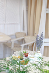 Serving a table in a restaurant in the style of Provence