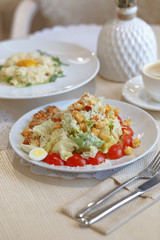 Appetizing Caesar salad on a white plate. Provence-style table serving