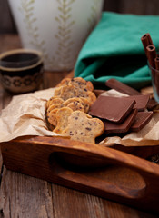 Homemade chocolate chip cookie. Baking, sweet snack. Food on a wooden table. Rustic style. Cooking at home. Chocolate for coffee.
