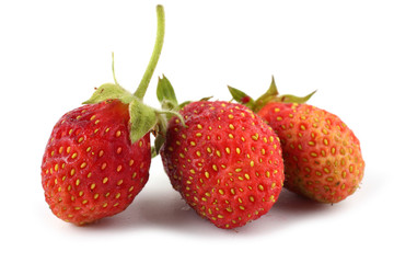 Three strawberries isolated on white