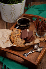 Homemade chocolate chip cookie. Baking, sweet snack. Food on a wooden table. Rustic style. Cooking at home. Chocolate for coffee.