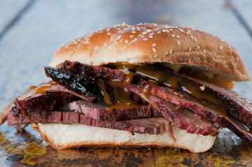 BBQ Sandwiches. Classic Traditional Texas barbecue sandwiches. Slow roasted pulled pork. Thick sliced smoked beef brisket. Chopped beef brisket with secret sauce bbq sauce. Served on white buns.