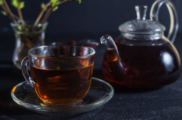 tea in a glass cup on a dark background