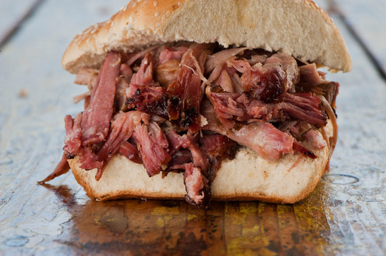 BBQ Sandwiches. Classic Traditional Texas barbecue sandwiches. Slow roasted pulled pork. Thick sliced smoked beef brisket. Chopped beef brisket with secret sauce bbq sauce. Served on white buns.