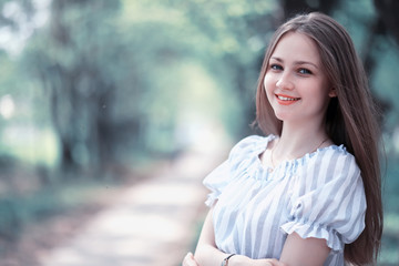 A girl in a spring green park