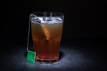 Cup of tea with a label with a dark solid background
