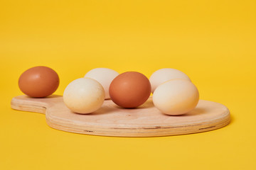 eggs in carton. Eggs on yellow background. Set of Eggs