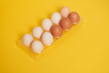 eggs in carton. Eggs on yellow background. Set of Eggs