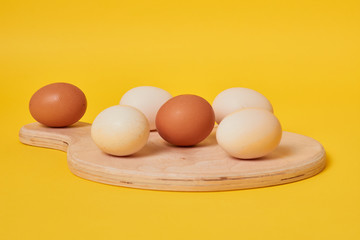eggs in carton. Eggs on yellow background. Set of Eggs