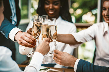 Fun Business People Clinking Of Glasses Champagne. Multi Ethnic Group Of Office Workers Clinking...
