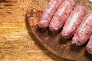 copy space. raw sausages semi-transparent plate. 