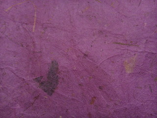 Wrinkled purple paper textured background. Mulberry paper. Rice paper texture.