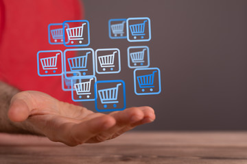 Businessman pressing modern technology panel shopping cart web phone credit card.