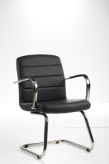 Obraz premium Black office chair isolated on white