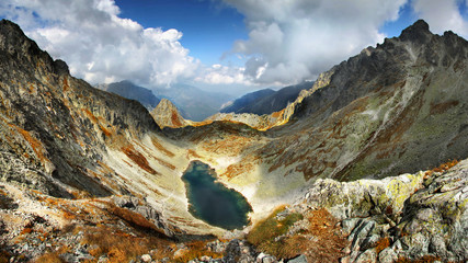 High mountains and alpine lake in summer scenic panorama view 