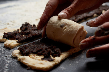 Baker prepares homemade cakes.