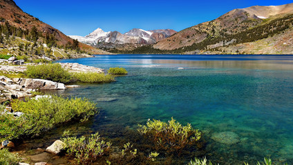 Fototapeta na wymiar Blue lake in high mountains scenic mountain landscape in summer panorama