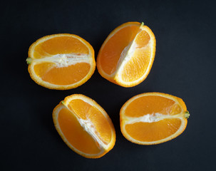 Fototapeta na wymiar Oranges on black wooden board, high resolution photo
