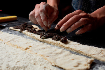 Baker prepares homemade cakes.
