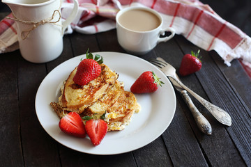 toast fried with egg with strawberries and coffee for Breakfast