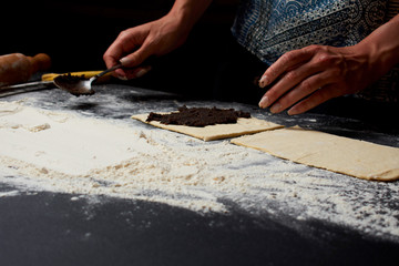 Baker prepares homemade cakes.