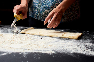 Baker prepares homemade cakes.