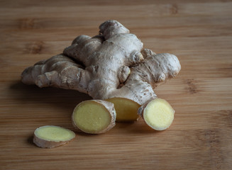 Ginger root on wooden table, high resolution photo