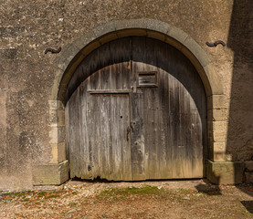 Fototapeta na wymiar old weathered wooden barn door