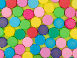 Colorful plastic caps for bottles.