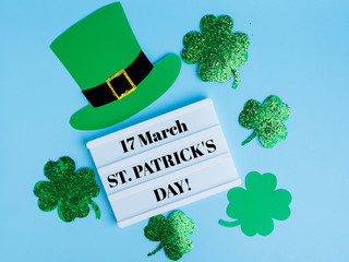 St Patricks Day concept. Shamrocks,  and leprechaun hat 