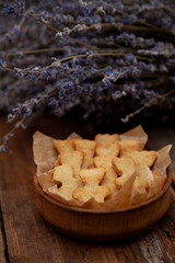 Homemade cookies in the shape of bears. Baking on the kitchen table. Flour product. Still life, close-up. Teddy bear cookies.